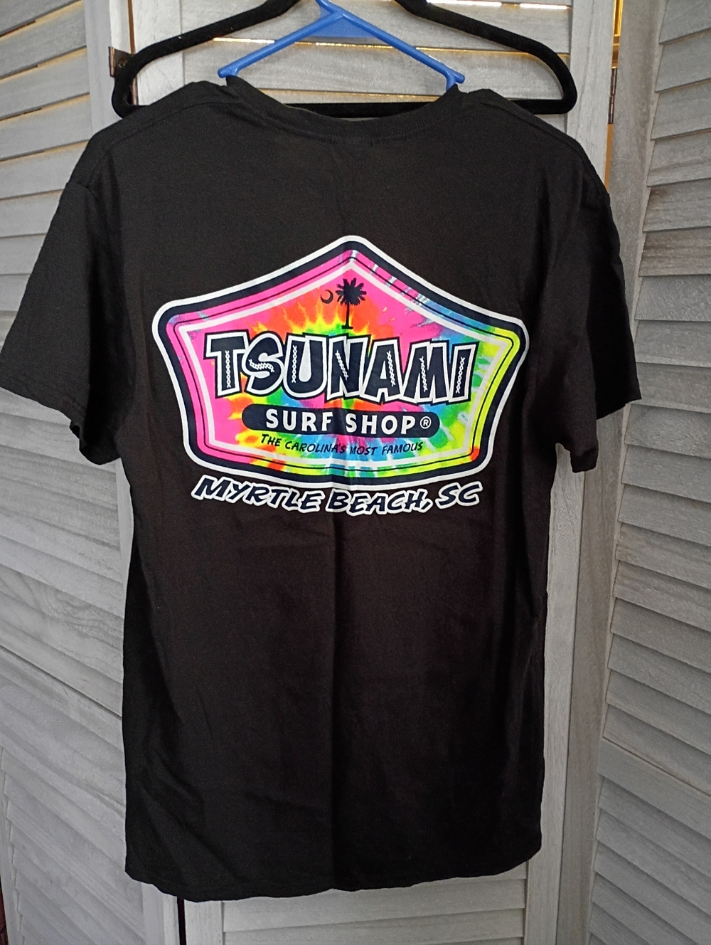 Tsunami Surf Shop Myrtle Beach Black Tee with Rainbow Tie Dye Logo